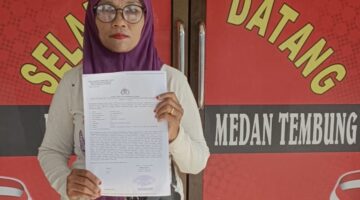 Hamsiah,Korban Dugaan Kekerasan Membuat Laporan Pengaduan Ke Polsek Medan Tembung. Foto / Bukhari 